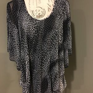 Ladies size large top. Very unique.
